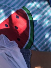 High angle view of woman relaxing on bed at home