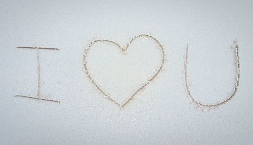 "i love you" written in sand