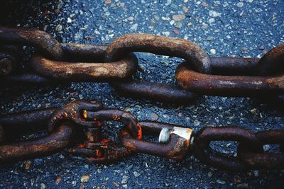 High angle view of rusty chain