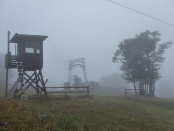 Built structure on field against sky