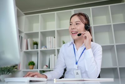 Portrait of young businesswoman working at home