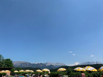 Scenic view of mountains against blue sky