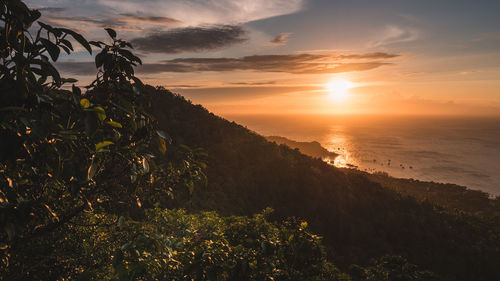 Scenic view of sunset orange sky over sea. shot from west coast viewpoint. koh tao island, thailand.