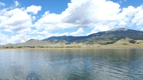 Scenic view of mountains against cloudy sky