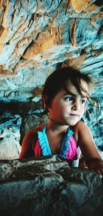 Portrait of girl standing on rock