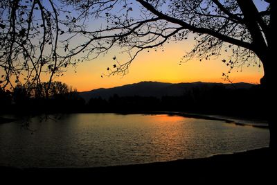 Scenic view of lake at sunset