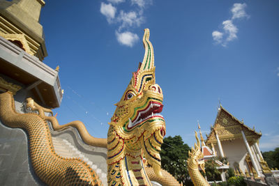 Low angle view of statue against sky