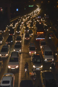 High angle view of traffic on city street at night