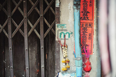 Incense on wall outside building