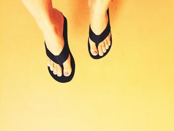 Low section of woman standing on floor