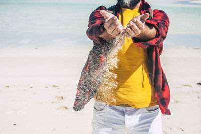 Full length of woman standing on beach