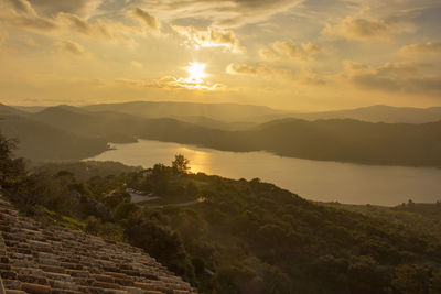 Scenic view of mountains against sky during sunset