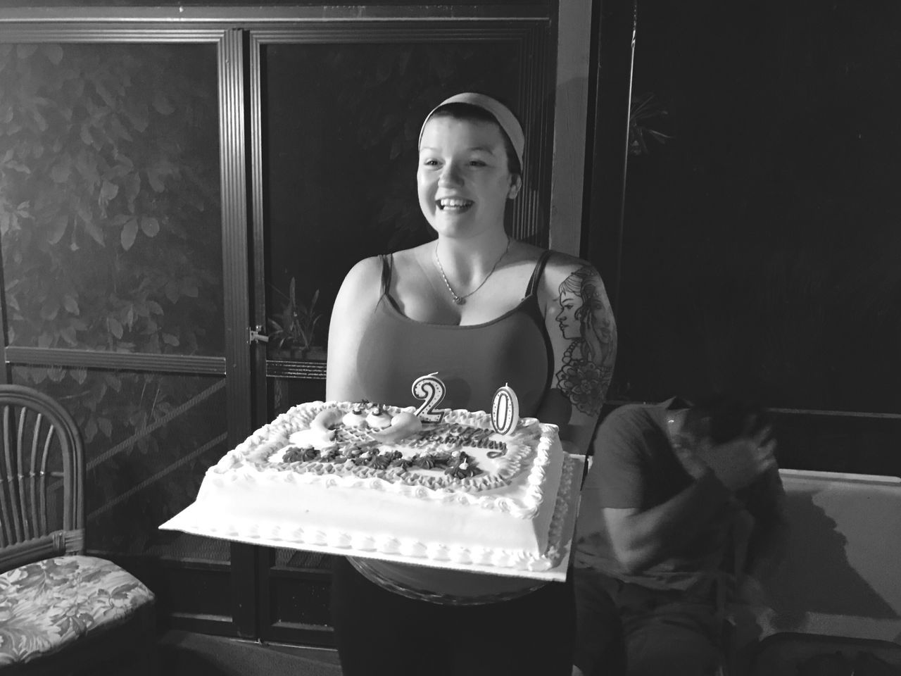 food, waist up, looking at camera, archival, portrait, food and drink, one person, domestic life, lifestyles, indoors, adult, people, bakery, adults only, only women, smiling, birthday cake, one woman only, night, fast food, formal portrait, human hand