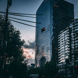 Low angle view of buildings against sky during sunset