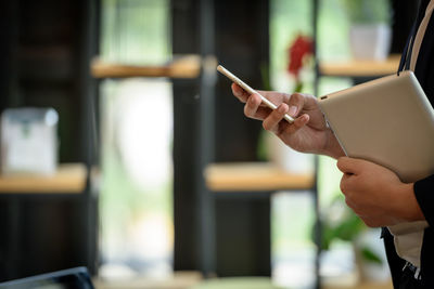 Close-up of woman using mobile phone