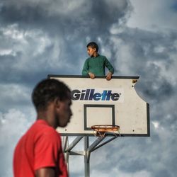 Low angle view of man standing against sky