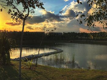 Scenic view of lake against sky during sunset