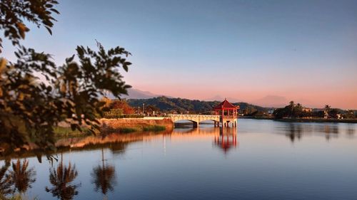 Scenic view of lake against sky during sunset