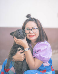 Portrait of smiling girl with dog