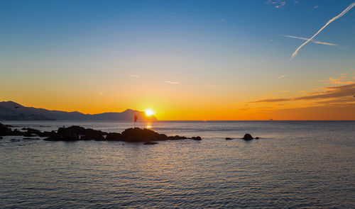 Scenic view of sea against sky during sunset