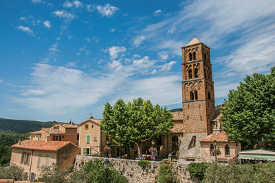 Panoramic view of houses, church and belfry at moustiers-sainte-marie, in the french provence.