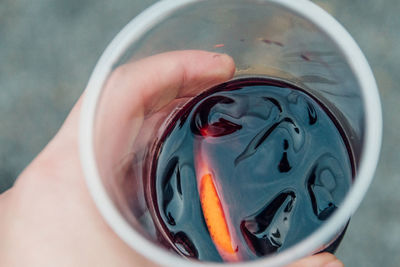 Cropped hand of person holding sangria
