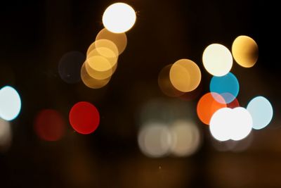 Defocused image of illuminated lights at night