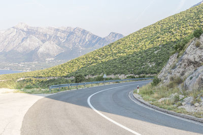 Country road leading towards mountains