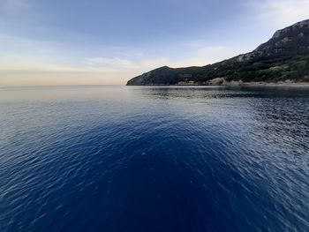 Scenic view of sea against sky at sunset