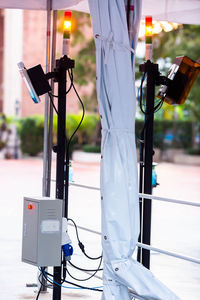 Close-up of illuminated lighting equipment on street