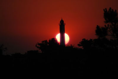 Silhouette of built structure against sky