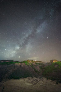 Scenic view of star field against sky at night