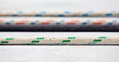 Close-up of multi colored pencils on rope