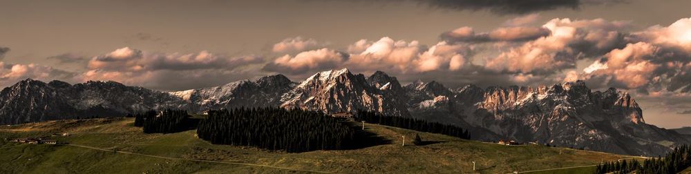 Scenic view of mountains against cloudy sky