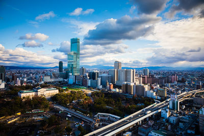 High angle view of modern buildings in city against sky