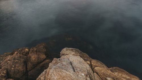 High angle view of rock formation in sea