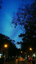 Low angle view of illuminated street light at night