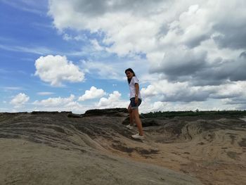 Full length side view of man standing on land