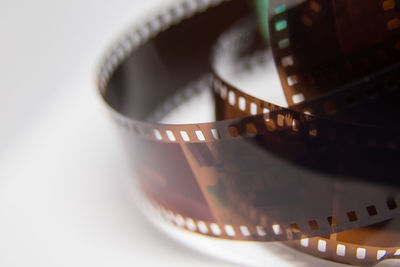 Close-up of film reel against gray background