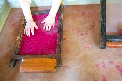 Low section of people standing on wooden floor