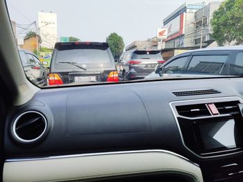 Cars on street seen through windshield