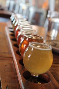 Close-up of beer in glass on table at restaurant