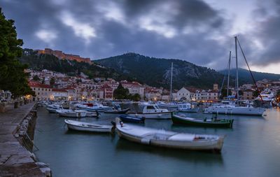 Boats moored at harbor