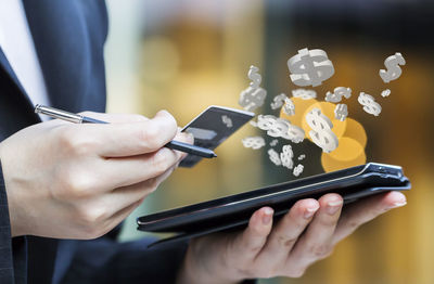 Close-up of man using mobile phone