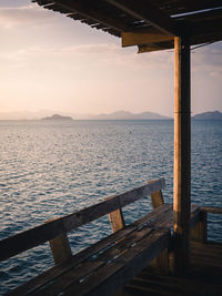 Scenic view of blue water bay with layer islands from wooden pier pavilion. koh mak island, thailand
