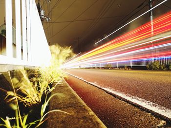 Light trails on road in city at night