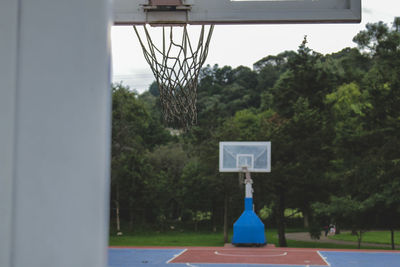 Close-up of basketball hoop against sky