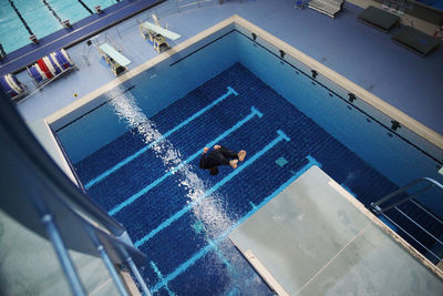 High angle view of man swimming in pool