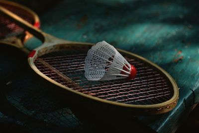 High angle view of shuttle cock on racket
