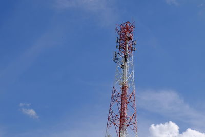 Low angle view of communications tower against sky